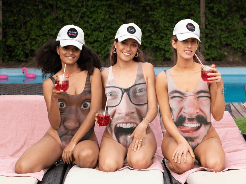 swimsuit mockup of three women wearing trucker hats at a bachelorette party 29675